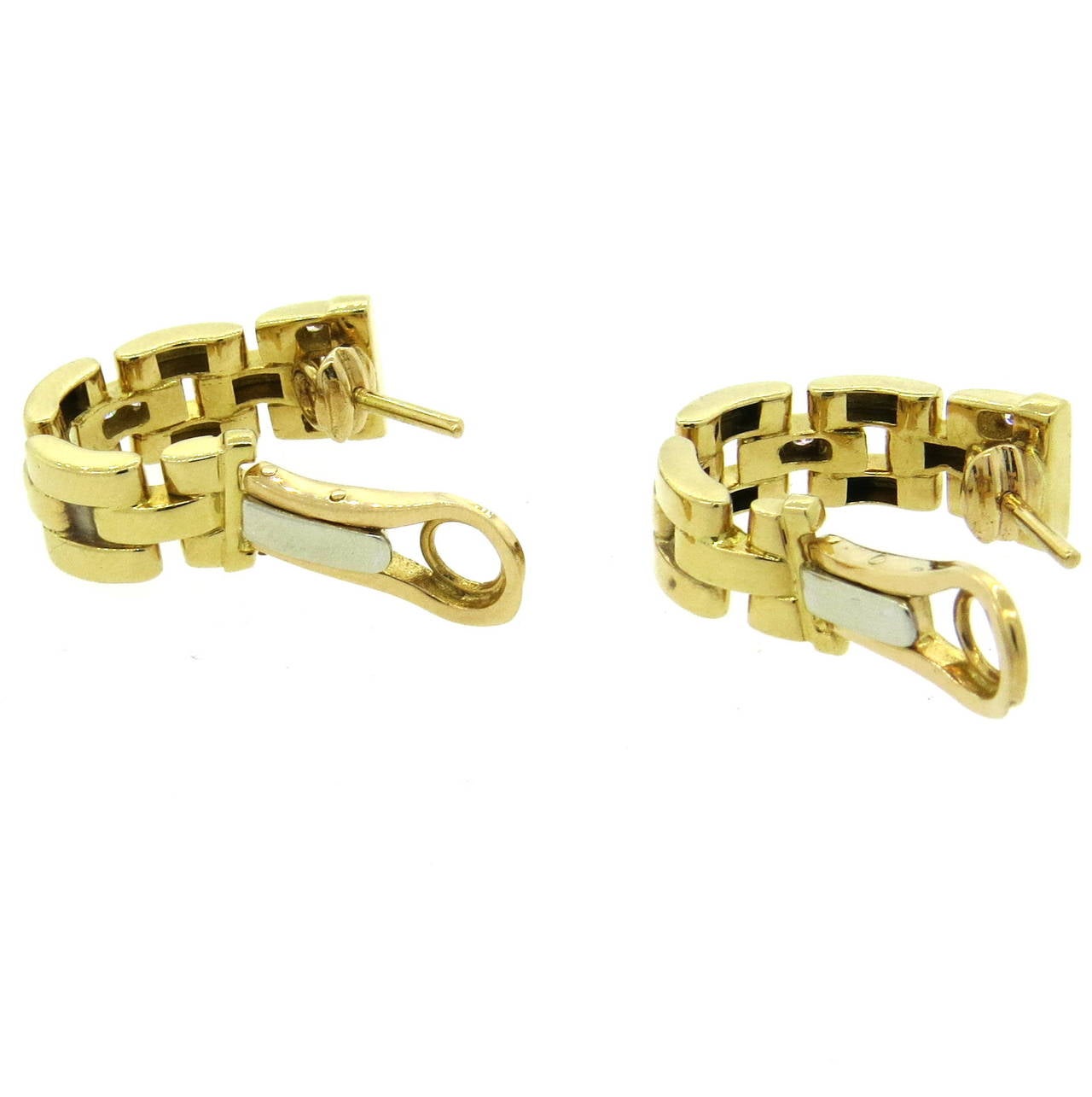 18k gold earrings by Cartier, from classic Panthere Maillon collection, adorned with diamonds. Earrings are 20mm long x 8mm wide. Marked Cartier,750,979656. Weight - 13.7 grams
