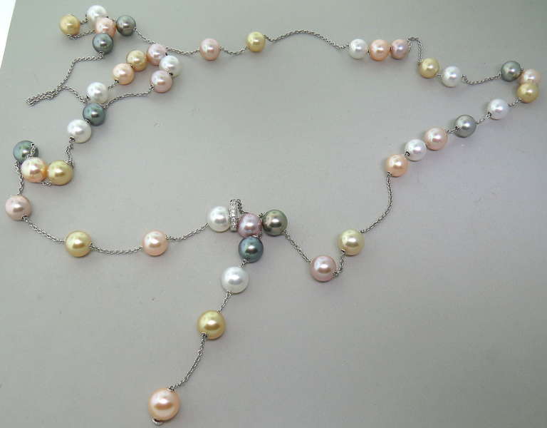 Long 18k white gold necklace by Mikimoto with multi color 9.5mm to 10mm pearls. Length can be adjusted up to 44