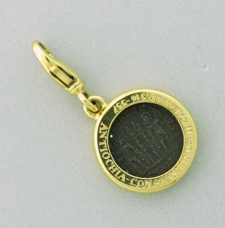 18k yellow gold charm with ancient coin by Bulgari. Pendant is 11mm in diameter, bale - 20mm long. Marked Antiochia-Constantinus II Caes.S.D.3.16-337,made in Italy,Bvlgari,750. weight - 11.1g