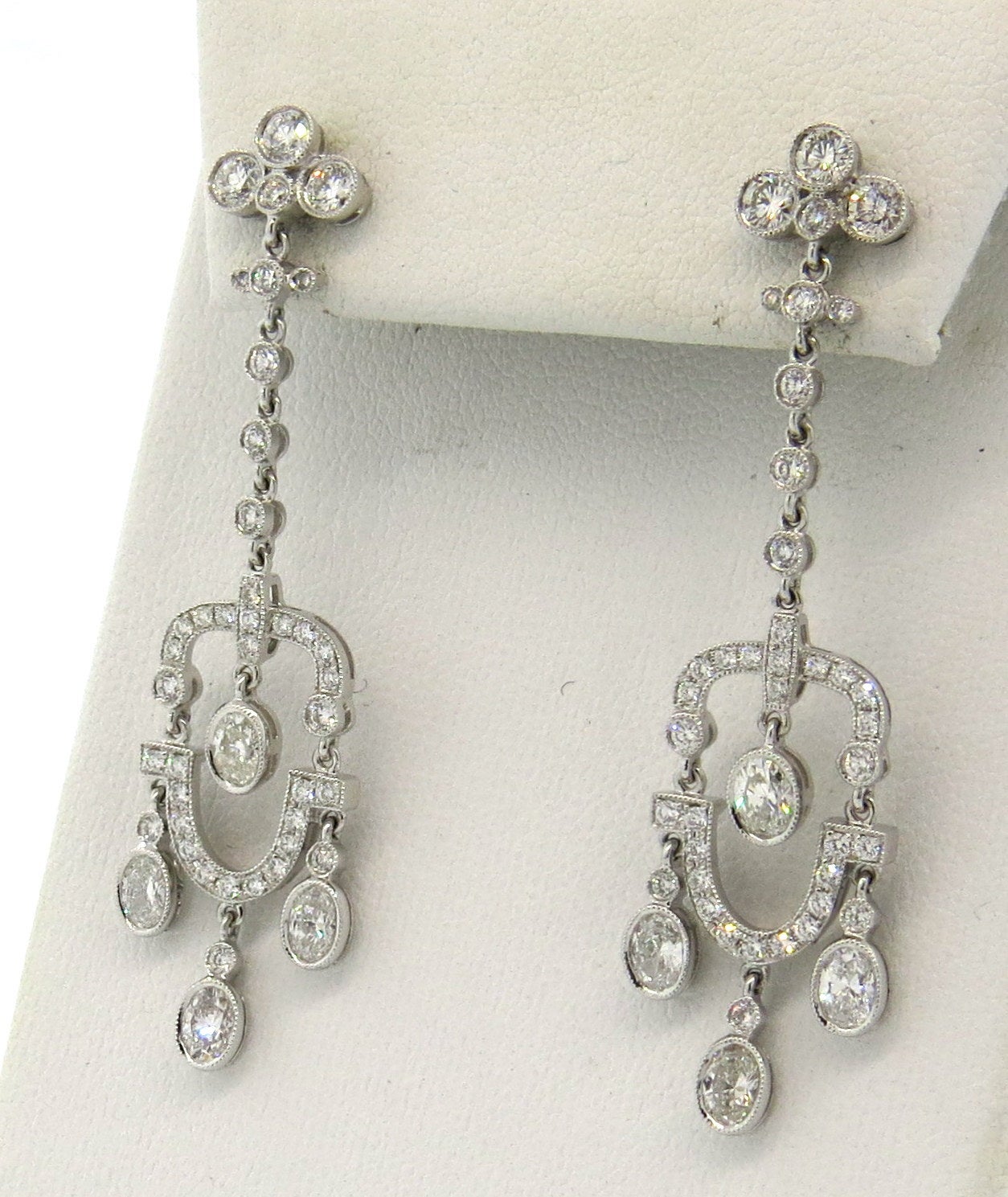18k gold chandelier earrings,featuring approximately 3.30ctw in diamonds. Earrings measure 54mm x 15mm. Weight - 8.9 grams
