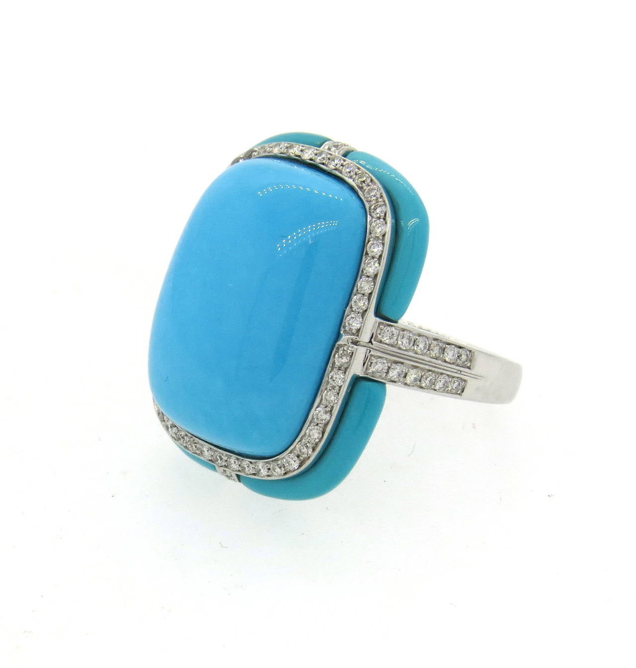 18k gold ring, featuring turquoise stones, surrounded with diamonds. Ring is a size 6 1/2, ring top is 24mm x 20mm. Weight - 11.8 grams