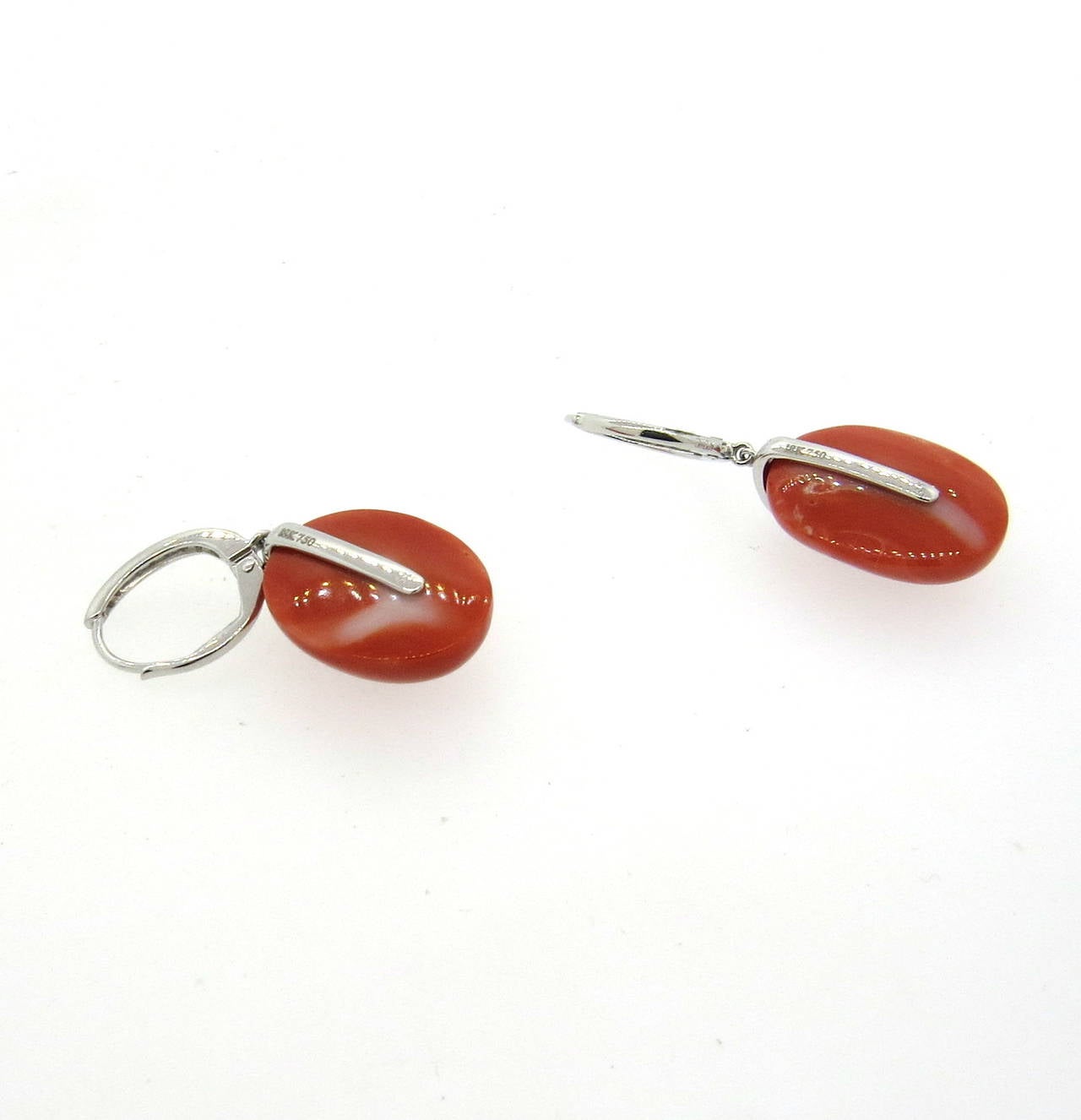 18k white gold drop earrings, set with diamonds and oval coral stones. Earrings are 37mm long, corals measure 20mm x 14mm. Weight - 8.9 grams