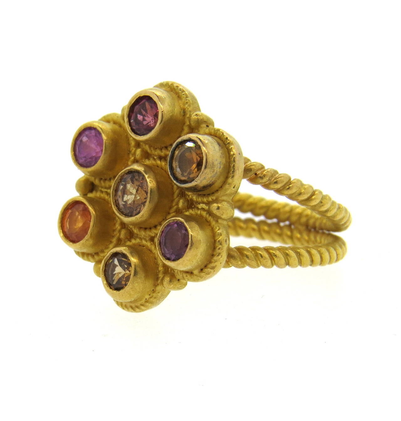 Reinstein Ross ring, crafted in 22k gold, featuring multicolor gemstones. Ring is a size 6, ring top is 19mm x 17mm. Marked R/R and 22k. Weight of the piece - 12.7 grams