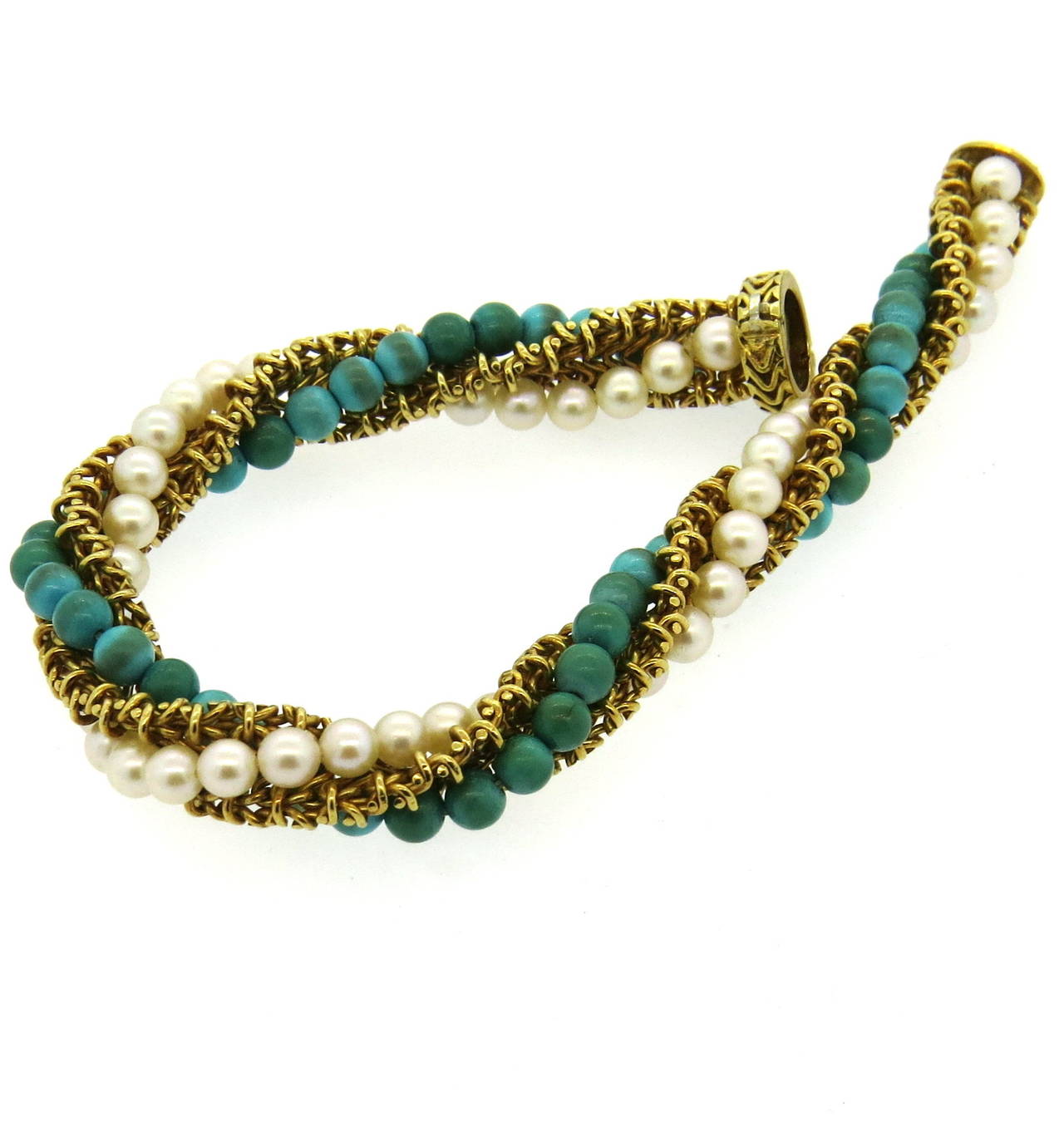1960s 18k gold bracelet,set with 4.7mm turquoise stones and 4.5mm pearls. Bracelet is 8 1/4