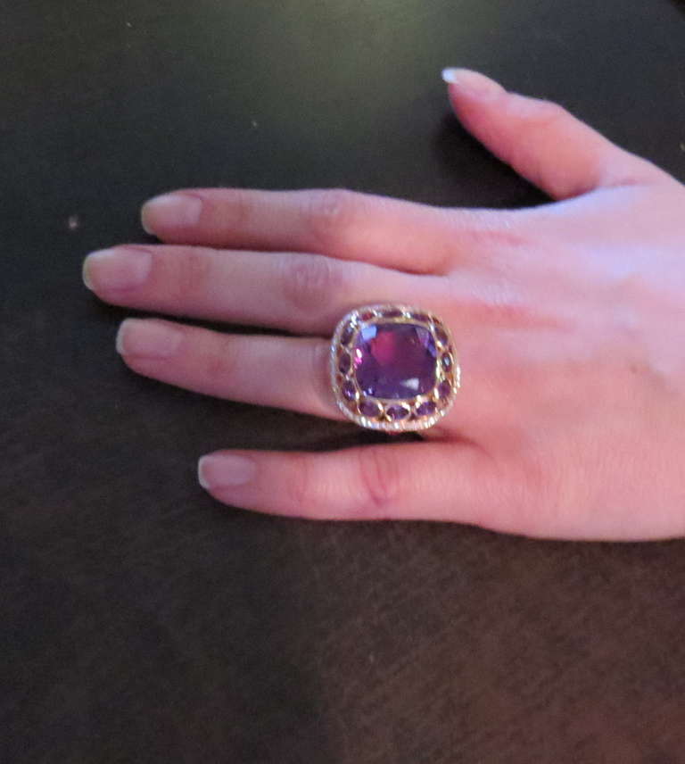 Metal: 18k Gold
Amethyst - 22ct
Pink Sapphires - 0.79ctw
Diamonds - 0.62ctw
Weight - 23.0 grams
Size - 6.5
Top Of Ring - 28mm x 29mm