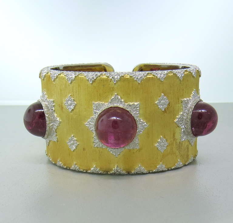 This impressive bracelet by Buccellati features three large Pink Tourmaline Cabochons - 13.5mm In Diameter.  The cuff is 35mm at the widest point, and comfortably fits up to a 6 1/4
