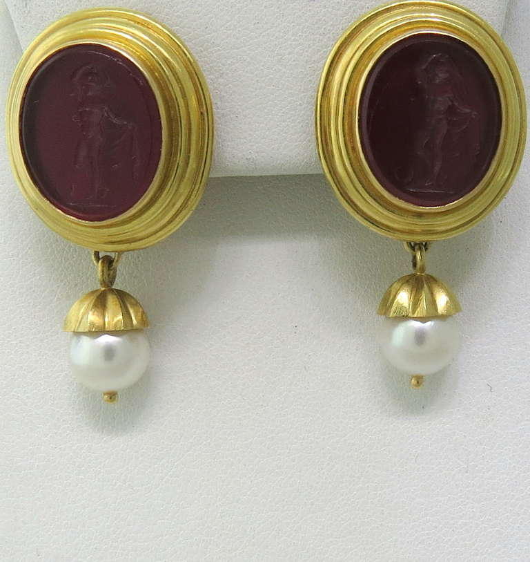Elizabeth Locke Gold Venetian Glass Intaglio Day Night Pearl Earrings
Metal: 18k Gold
Purple Venetian Glass Intaglio - 17mm x 14mm
Pearls - 8.2mm In Diameter
Earrings (w Drop) - 41mm x 22mm
Earrings (w/o Drop) - 24mm x 22mm
Weight - 27.4 grams