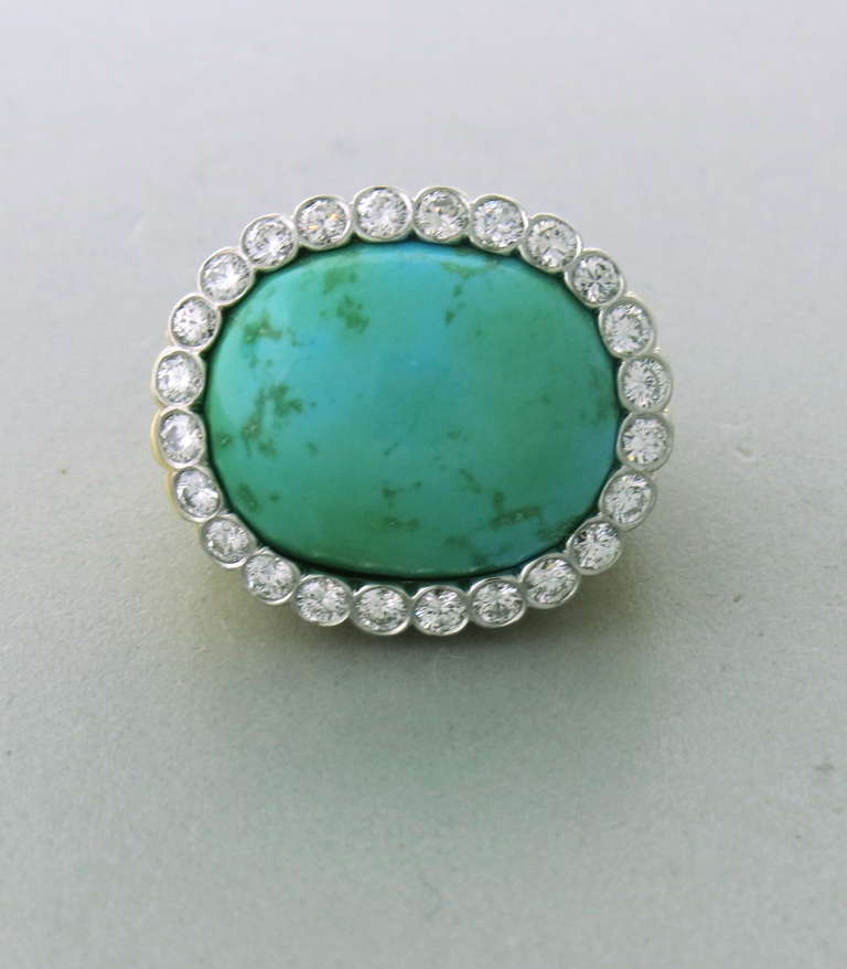 Vintage 18k yellow gold ring with 17mm x 21mm turquoise, surrounded by approx. 1.20-1.30ctw diamonds. Ring size 6, ring top is 23mm x 26mm. weight 30.3g