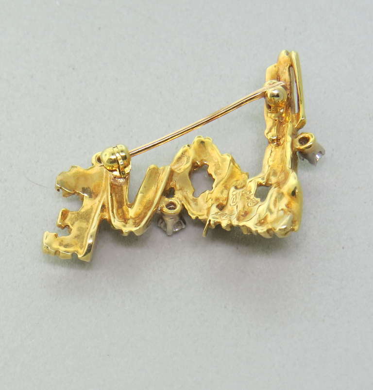 18k yellow gold and platinum brooch by Peter Lindeman with approx. 0.16ctw diamonds. Brooch is 38mm x 29mm. Marked PL,18k. weight 8.2g