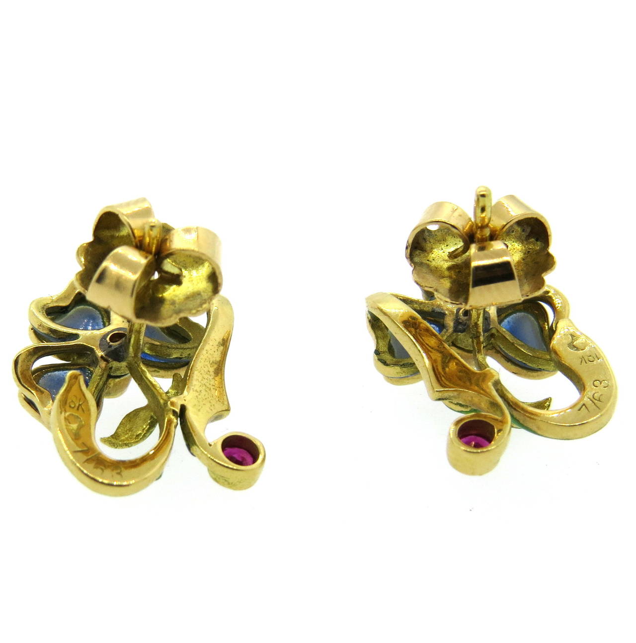 Adorable and delicate 18k gold earrings, crafted in a plique a jour enamel flower design, featuring two diamonds, approximately 0.06ct each and two rubies. Earrings measure 18mm x 15mm. Weight - 7.7 grams
