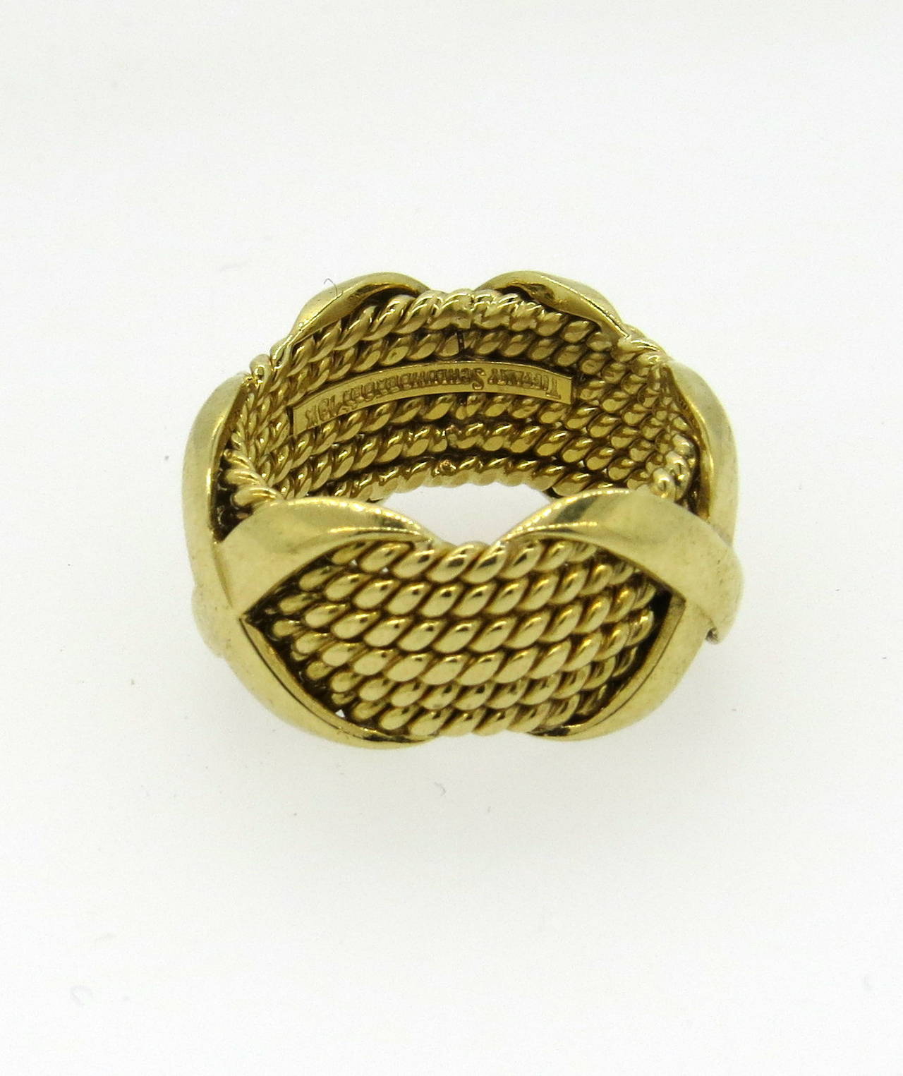 18k gold band ring, designed by Jean Schlumberger for Tiffany & Co ,from Rope collection. Ring is a size 5 1/2 and is 11.3mm wide. Marked Tiffany & Co, Shclumberger 18k. Weight  of the piece - 11.9 grams
