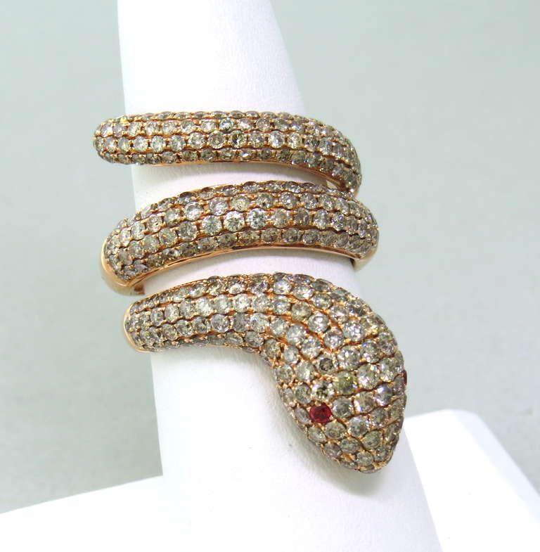 18k rose gold snake ring with 4.15ctw fancy color diamonds and ruby eyes. Ring size  7 1/4, ring is 35mm wide. weight 10.5g