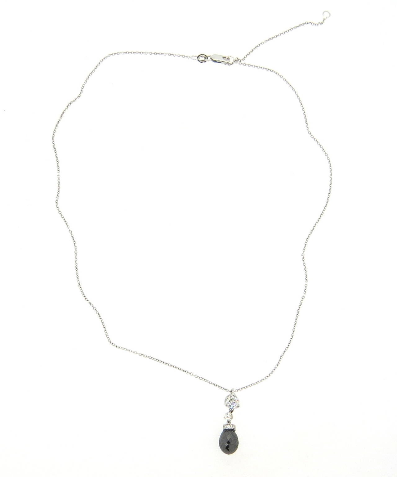 18k white gold chain necklace, crafted by Roberto Coin, featuring white and black briolette diamond pendant. Necklace is 18