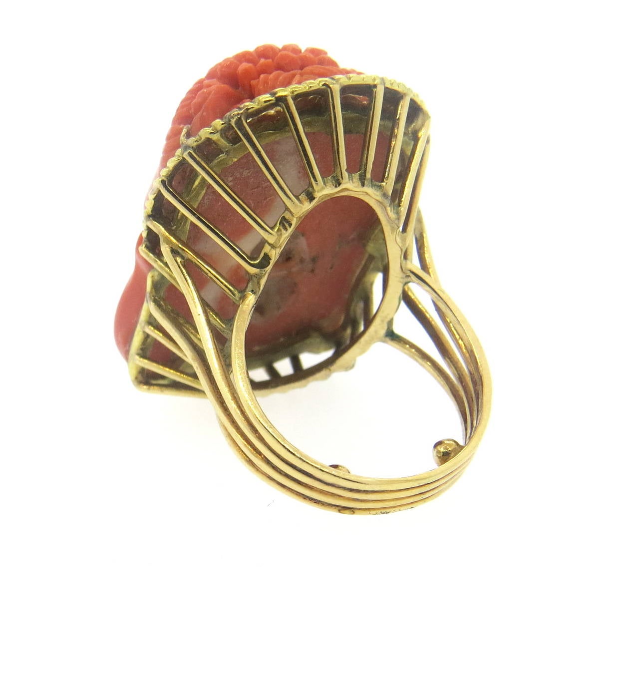 Large 18k gold ring, featuring carved coral gemstones. Ring is a size 7 (sizing balls can be removed to increase size) ring top is 36mm x 24mm. Weight of the piece - 23 grams