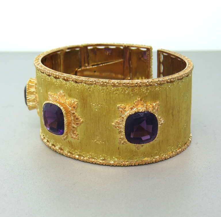 Beautiful 18k gold cuff with 3 10.5mm x 10.3mm amethyst gemstones. Bracelet will fit up to 6