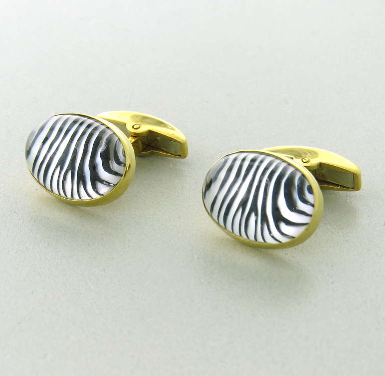 18k gold oval cufflinks with zebra reverse painting under rock crystal. Cufflink top - 18.6mm  x13.9mm. Marked Aldn,English gold marks. weight - 16.7g