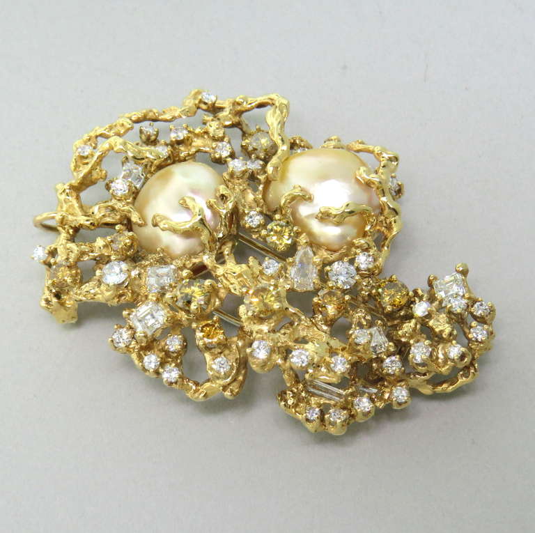 18k yellow gold large brooch/pendant by Arthur King with two South Sea baroque pearls,measuring 17mm x 13.3mm and 16mm x 13.2mm, and approx. 3.00ctw of fancy color diamonds and  3.50ctw white diamonds - square , pear and round cut. Brooch is 65mm x