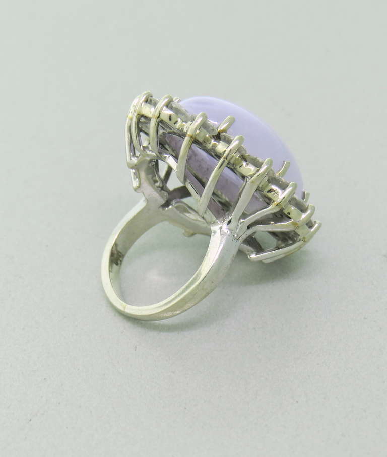Metal: 14k White Gold
Gemstones: Lavender Jade (20.72 x 15.18 x 7.32mm) - 20.76ct, Diamonds - 2.89ct F-G-H Color / VS Clarity
Ring Size - 4 (Easily Sizable), Top Of Ring - 29mm x 23mm
Weight: 13.4 grams