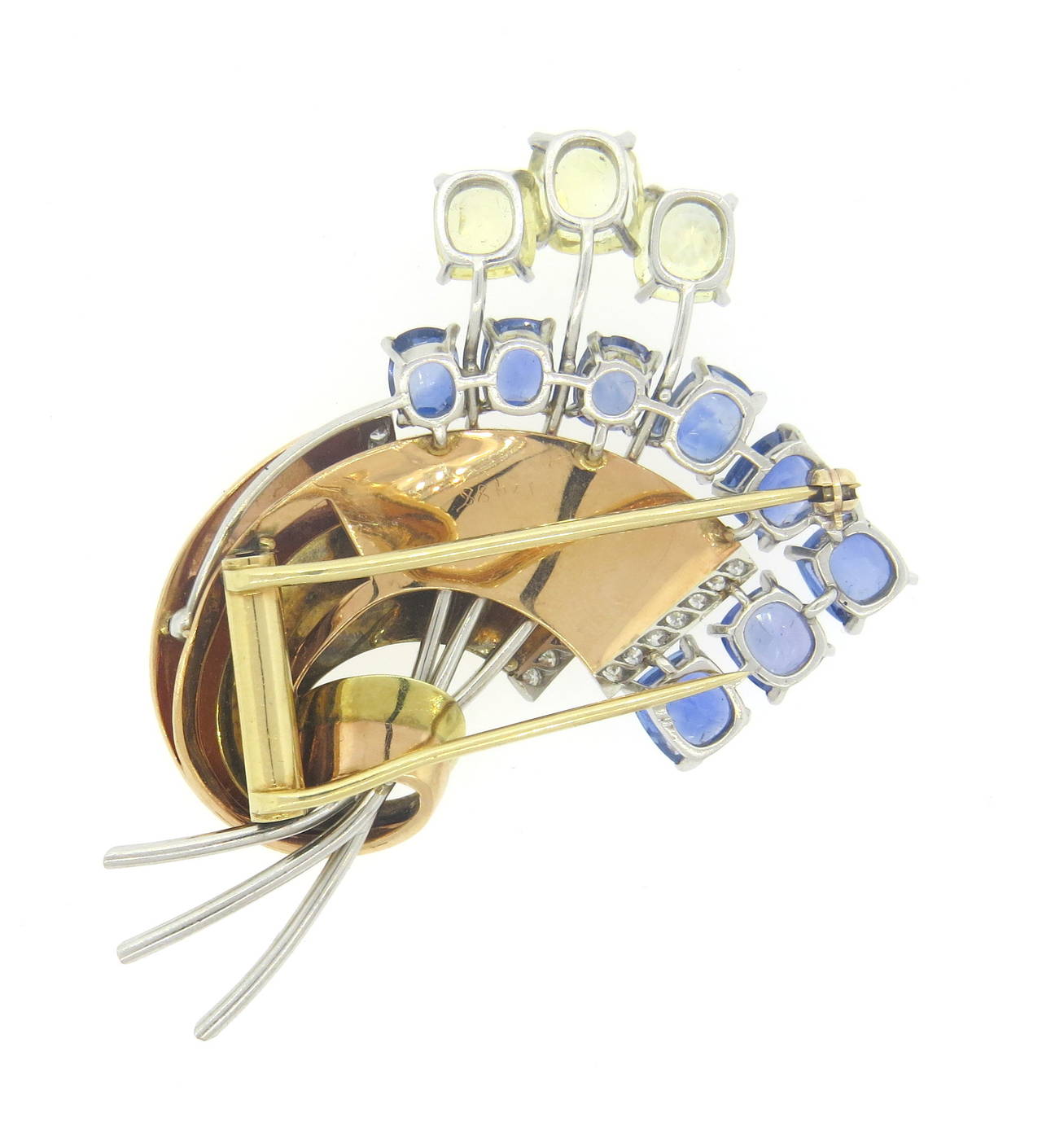 Mid century brooch, crafted in yellow and rose 14k gold with platinum accents, featuring EGL certified no heat sapphires and round brilliant diamonds. Brooch measures 55mm x 45mm. Weight of the piece - 30.8 grams