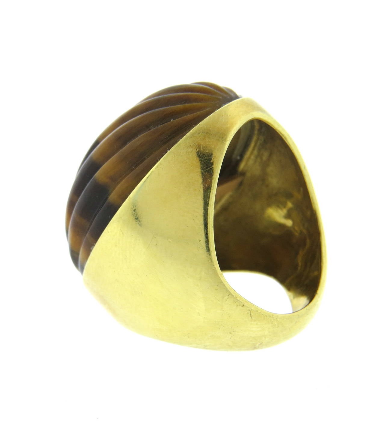 Large vintage 18k gold ring, featuring ribbed oval tiger's eye. Ring is a size 7, ring top is 31mm x 22mm. Weight of the piece - 24.8 grams