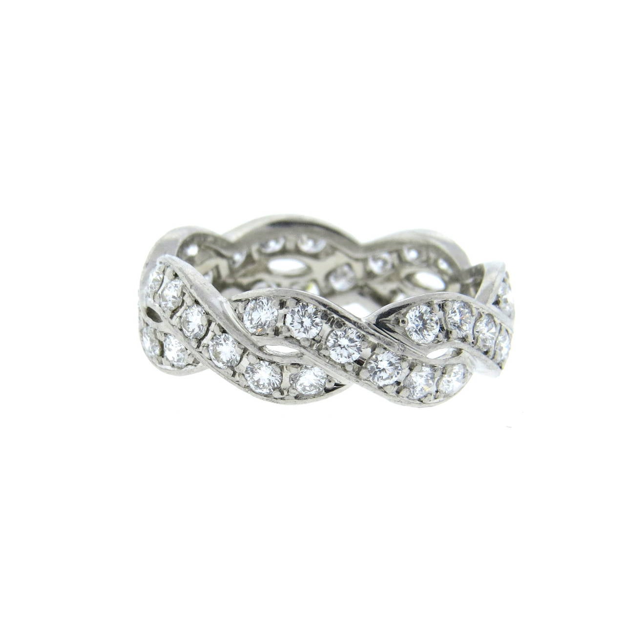 Platinum braided band ring, featuring approximately 1.10-1.20ctw in FG/VS diamonds. Ring is a size 6 1/2, ring is 6.2mm wide. Marked Suwa,pt950,483T6. Weight - 5.4 grams