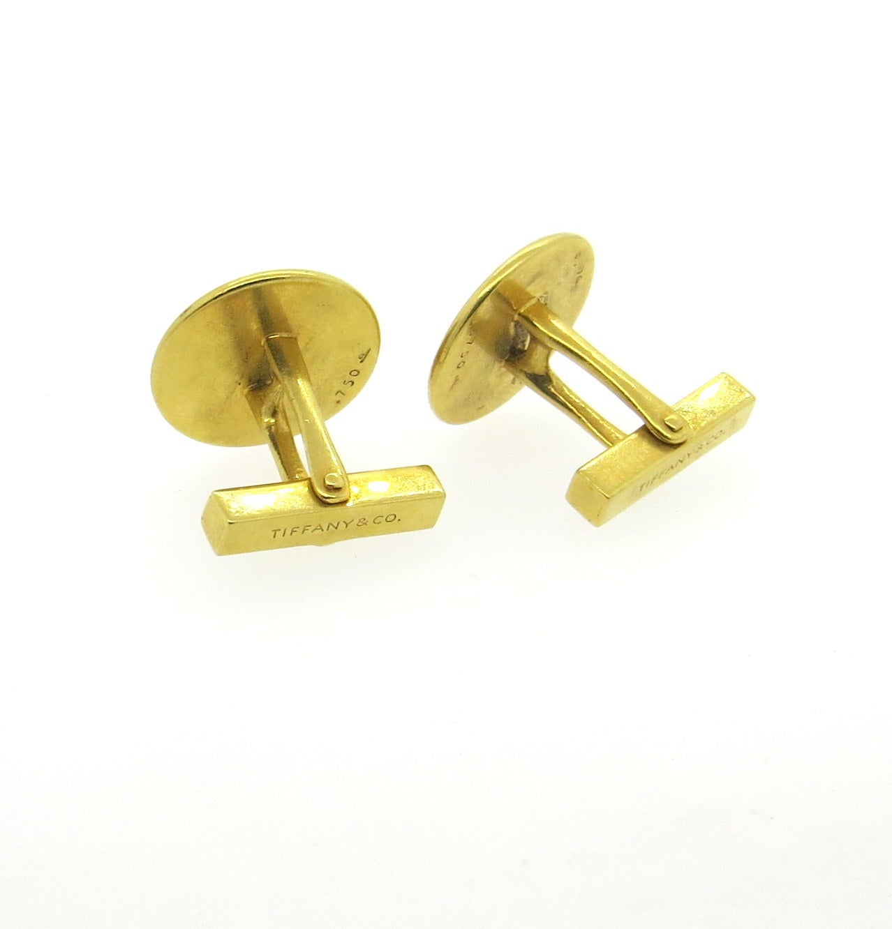 18k yellow gold button cufflinks, designed by Tiffany & Co., measuring 19mm in diameter. Marked Tiffany & Co. and 750. Weight - 18.9 grams
