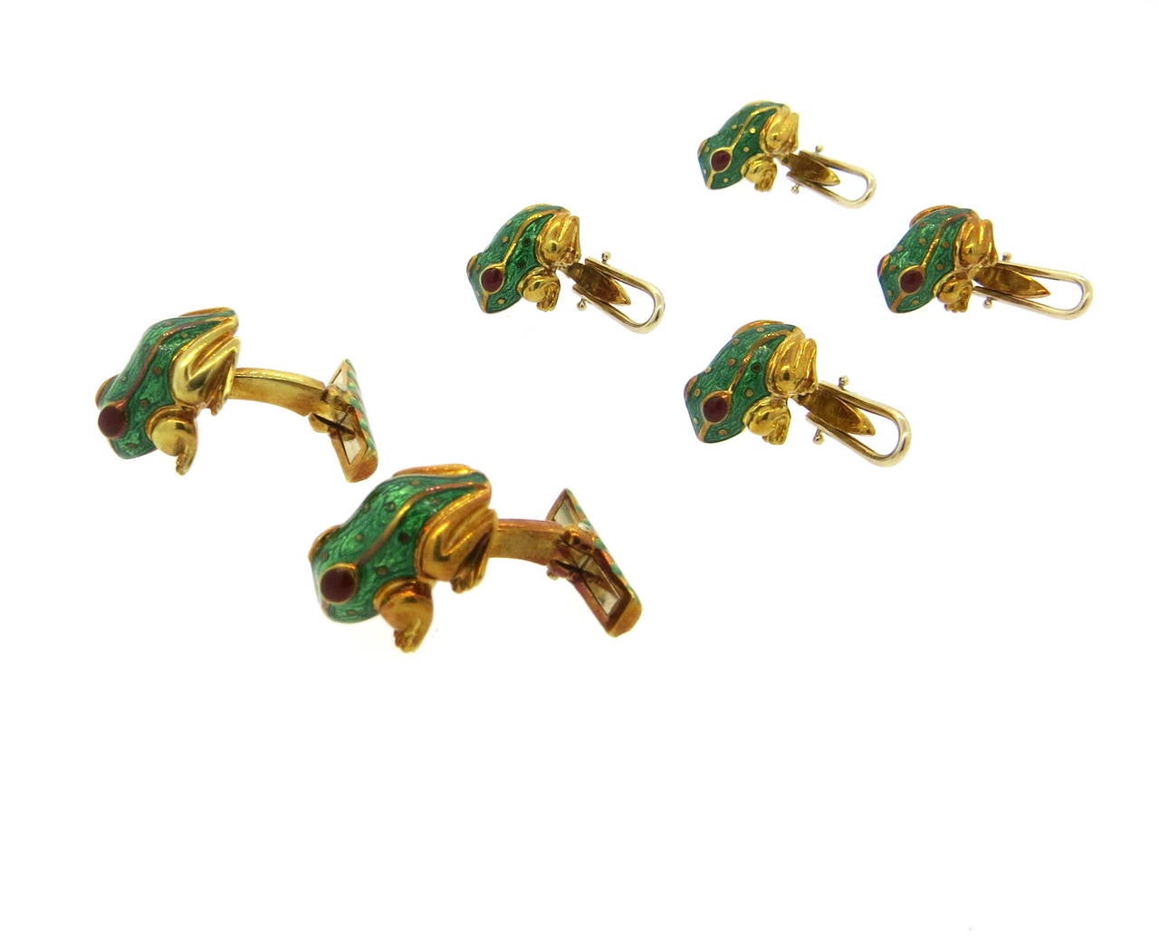 18k gold classic David Webb cufflinks and studs set, featuring frogs , decorated with green enamel and ruby eyes. Cufflinks measure 17mm x 15mm, studs - 15mm x 13mm. Marked 18k and Webb. Weight of the set - 36 grams