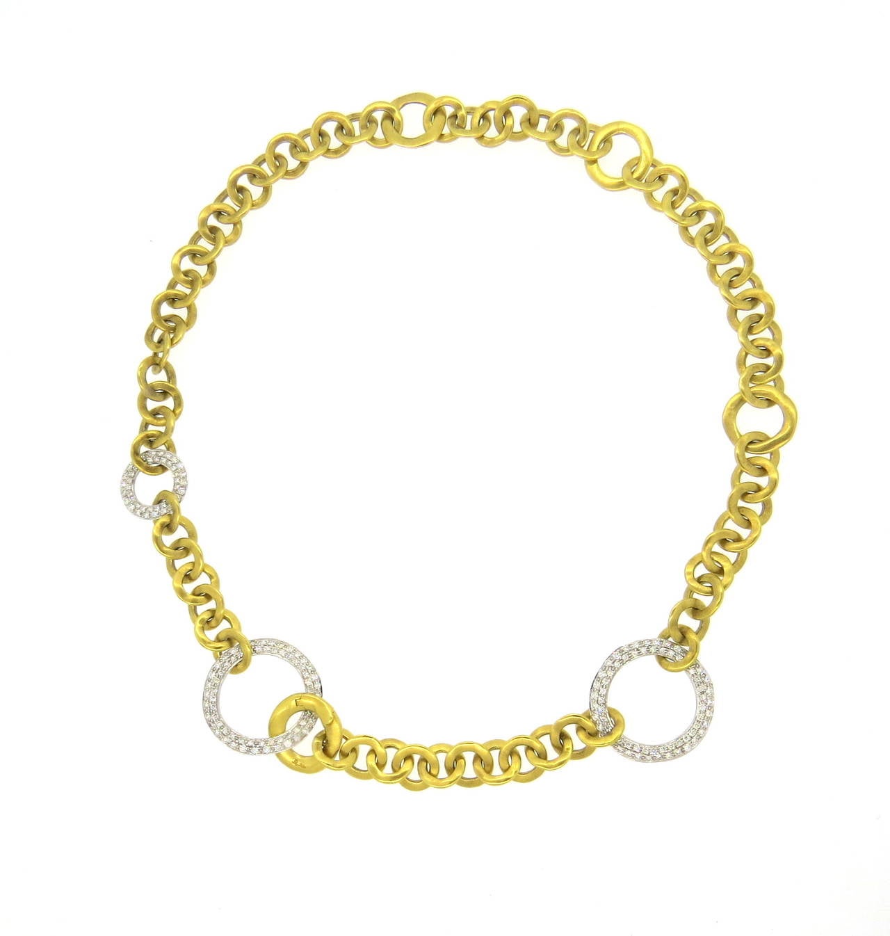 An 18k yellow gold circle link necklace, set with approximately 1.90ctw of G/VS diamonds.  Crafted by Pomellato, the necklace measures 16