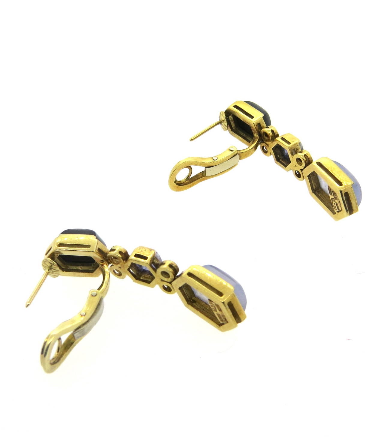 A pair of 18k yellow gold earrings set with approximately 0.80ctw in G/VS diamond along with iolite onyx and chalcedony stones.  The earrings measure 43mm x 10mm and weigh 20.3 grams