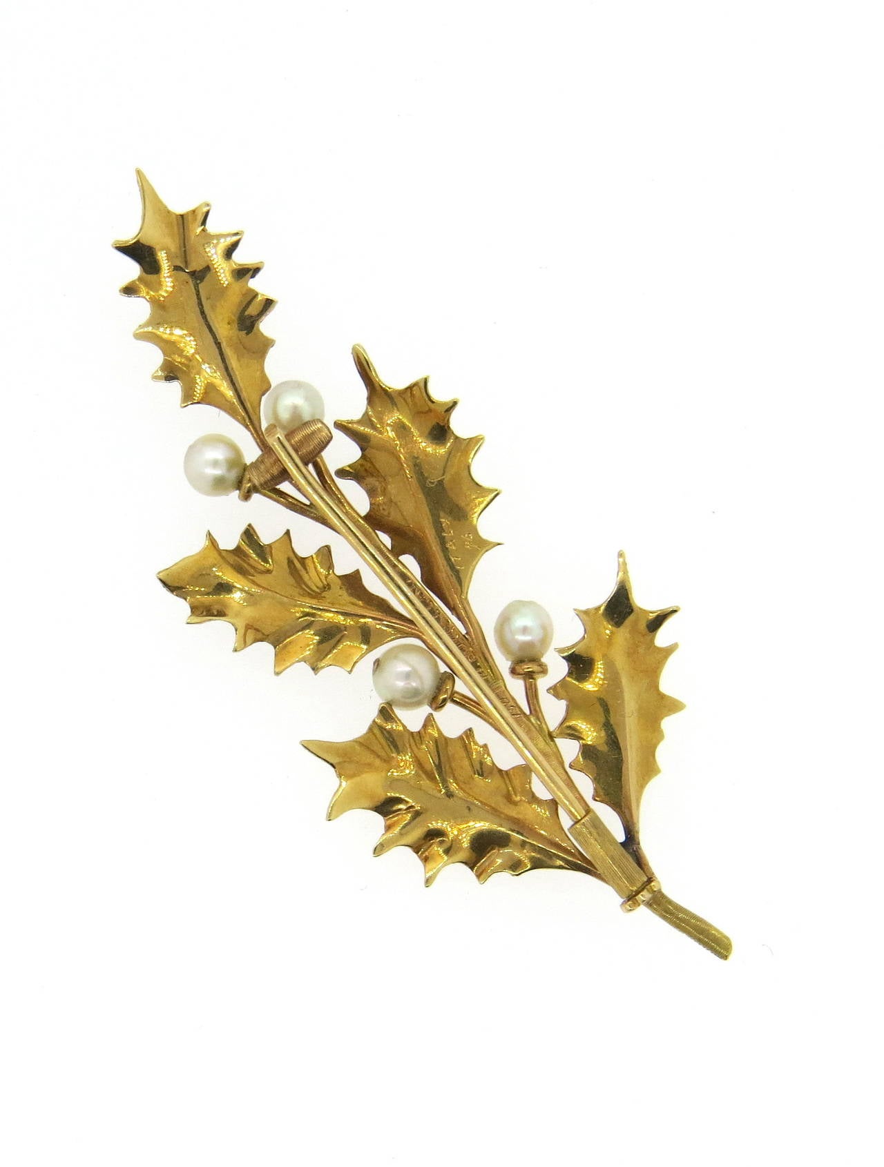 18k gold brooch pin, crafted by Mario Buccellati, set with four pearls, featuring leaf motif. Brooch measures 65mm x 27mm. Marked 750,Italy 96, M. Buccellati. Weight of the piece - 7.7 grams