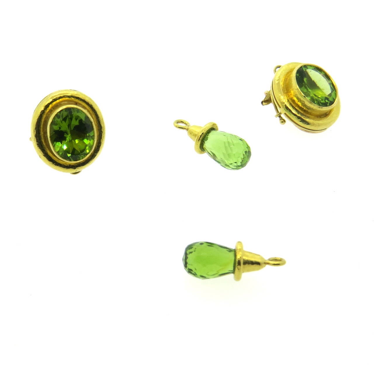 A pair of 18k yellow gold earrings set with faceted peridot and detachable peridot briolettes.  Crafted by Elizabeth Locke, the earrings measure 39mm x 17mm with the drops attached.  The weight of the earrings is 19.3 grams.