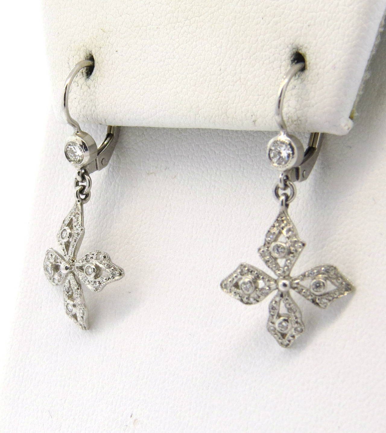 A pair of platinum earrings set with approximately 0.30ctw of G/VS diamonds.  Crafted by Cathy Waterman, the earrings measure 33mm x 10mm including the wire.  Marked CW, 900PT. Weight - 4.6 grams