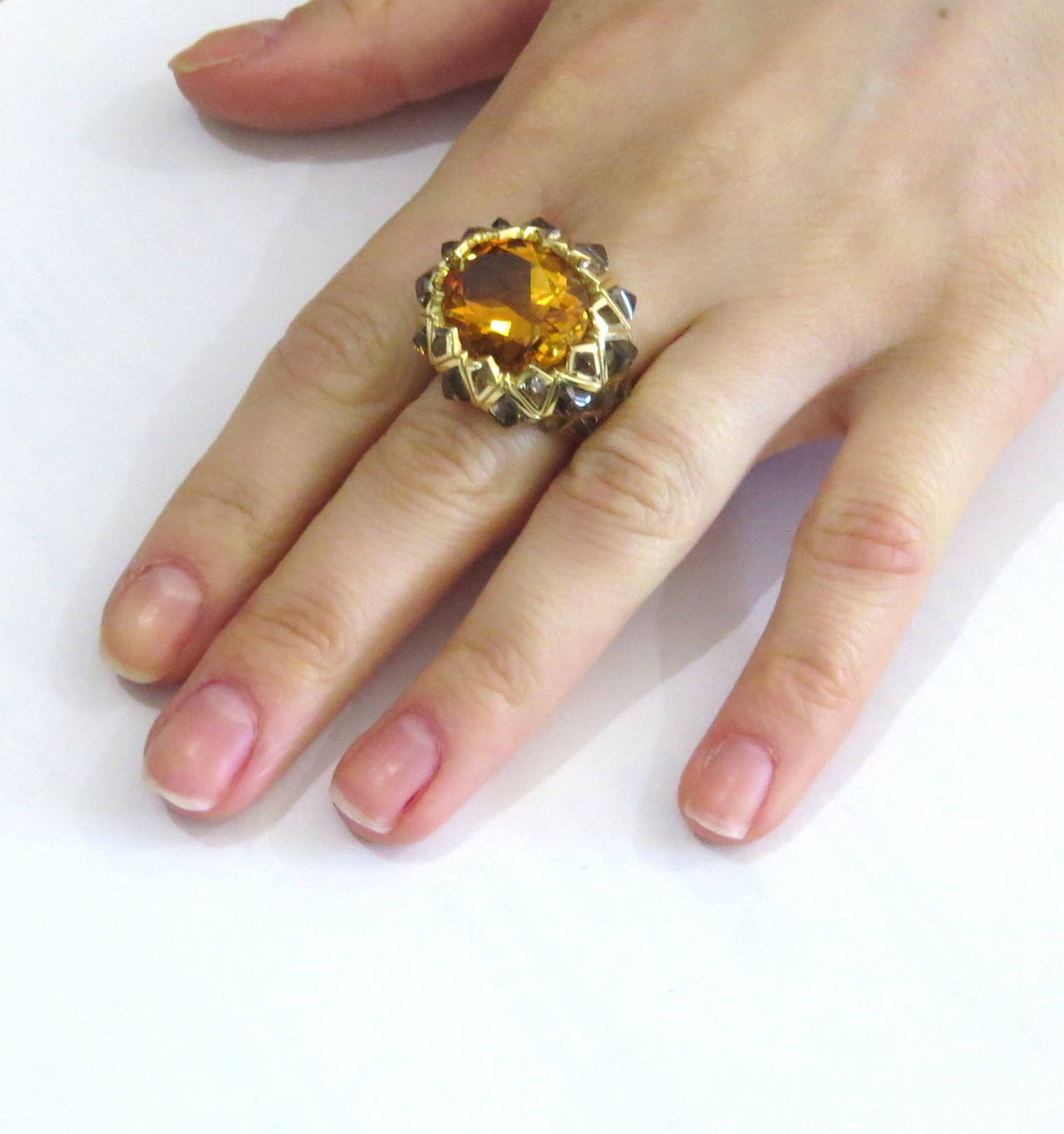 Large and impressive limited edition 70 of 222 made. This 18k gold ring crafted by Stephen Webster, featuring 29.3m x 15.5mm citrine, surrounded with spiked quartz stones. Ring is a size 7 and top measures 25mm x 29mm and sits approximately 10mm