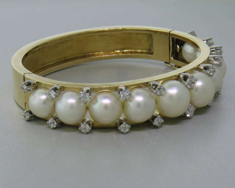 14k gold bracelet with 8.4mm to 10.4mm pearls and diamonds. Bracelet will fit up to 7