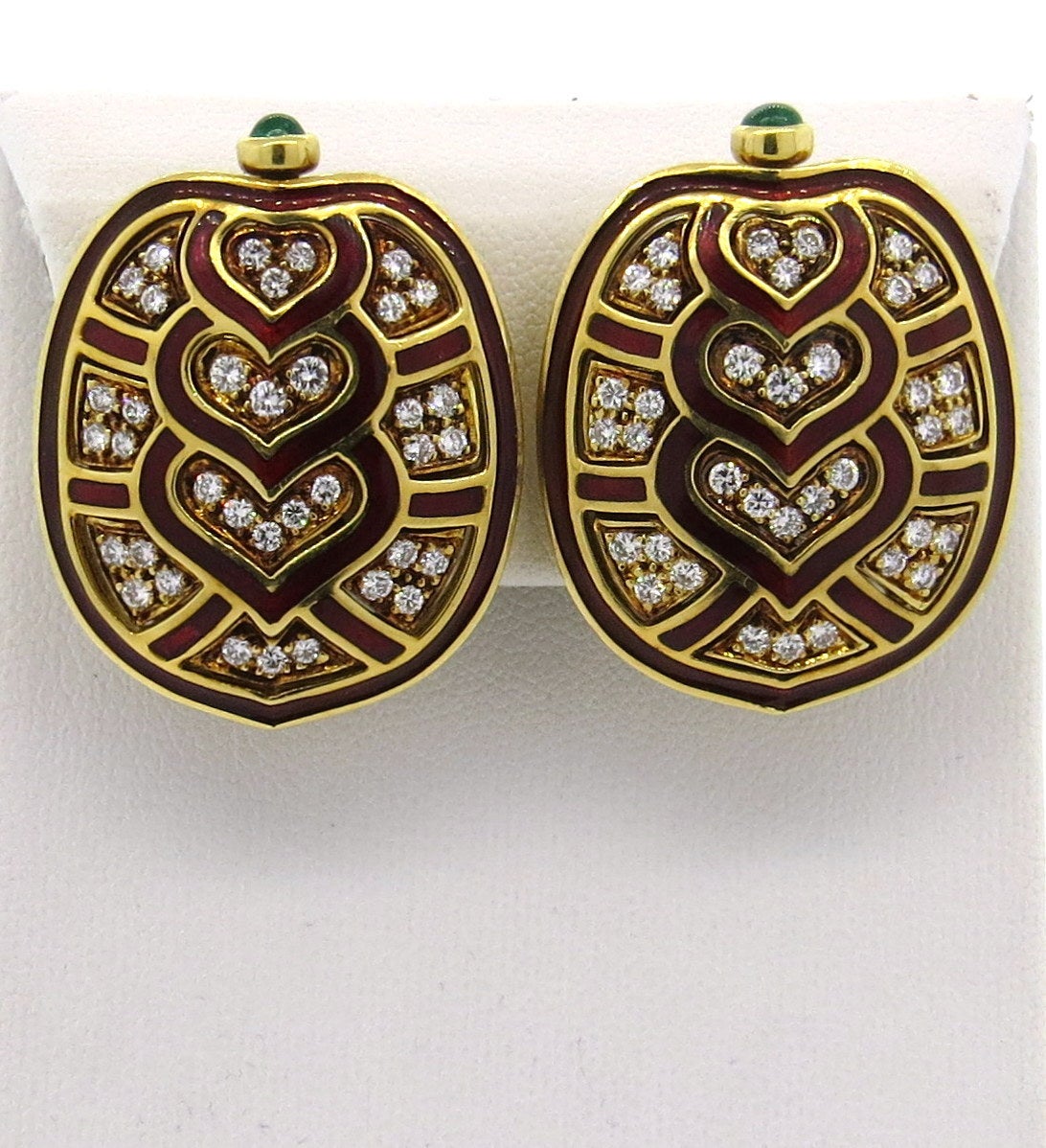 Impressive 18k gold earrings, designed by Judith Leiber, featuring turtle shell design, decorated with red enamel, emerald cabochons and approx. 2.00ctw in diamonds. Measure 33mm x 25mm. Marked Judith Leiber and 750. Weight - 38.1 grams