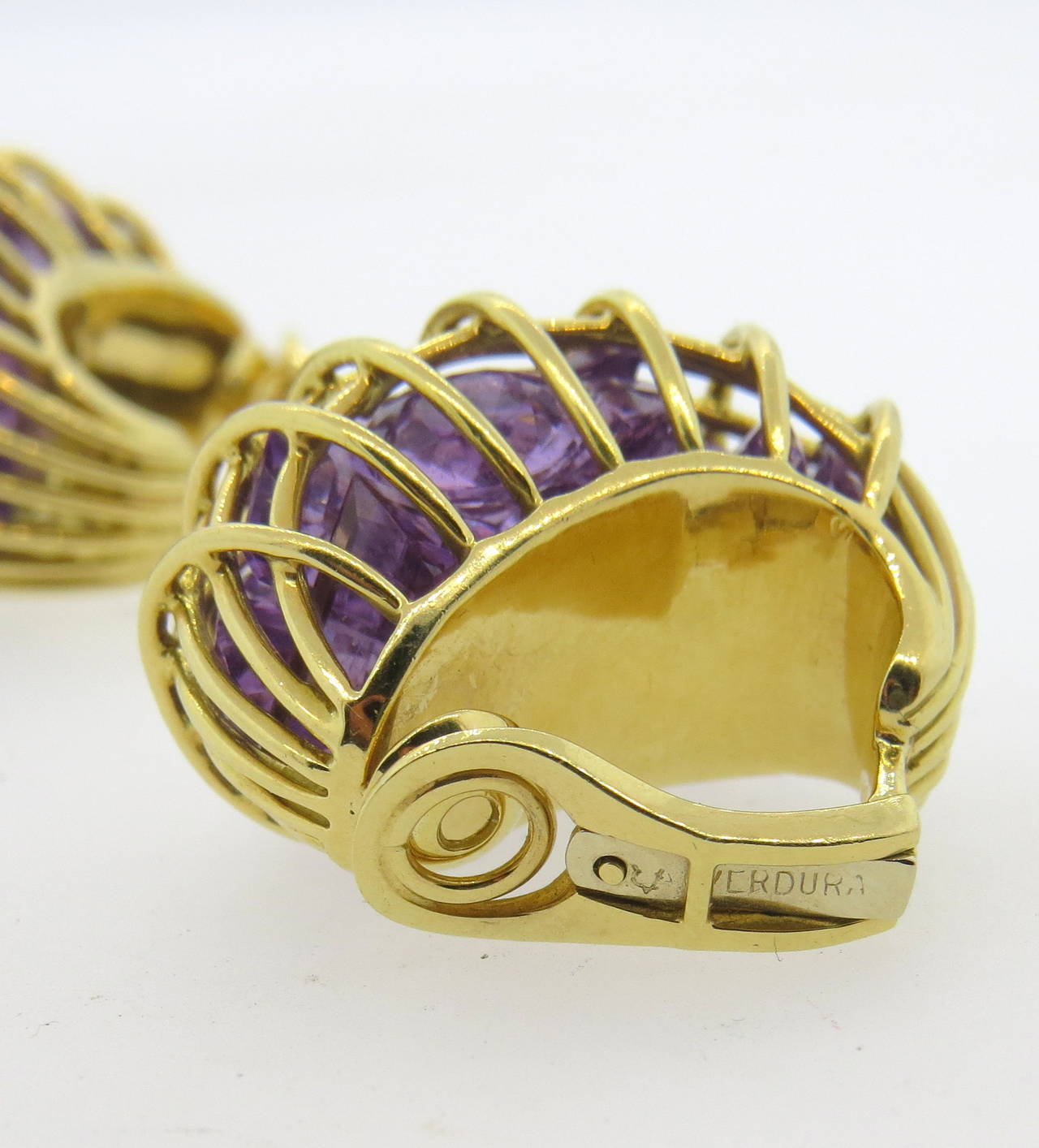 Impressive 18k gold Cage earrings, set with fancy cut loose amethyst stones, set in a caged gold design. Earrings are 27mm x 20mm. Marked Verdura. Weight - 37.8 grams.