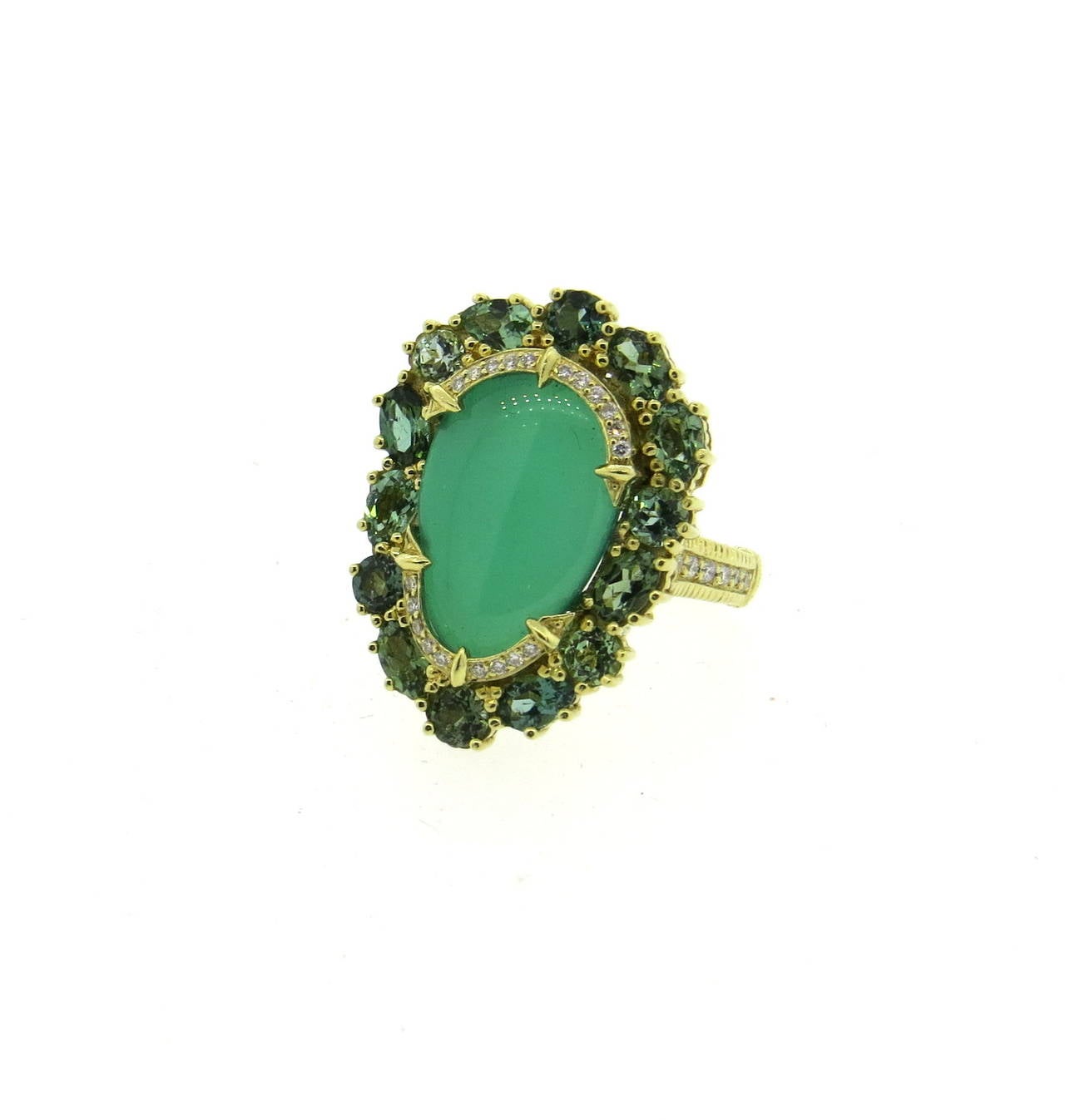 An 18k yellow gold ring set with approximately 0.15ctw of G/VS diamonds, Green Chalcedony Tourmaline and Peridot.  Crafted by Judith Ripka, the ring is a size 7.25,  The top of the ring measures 28mm x 22mm.  The weight of the piece is 13.8 grams.