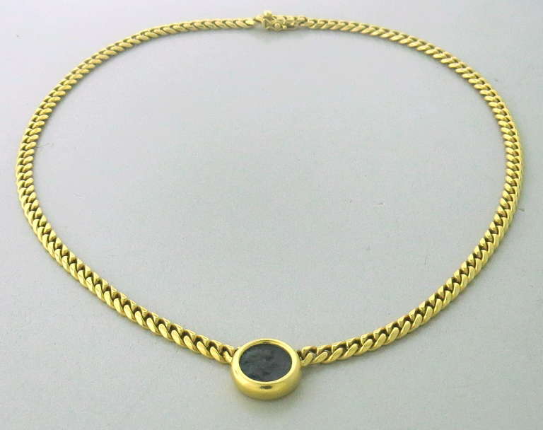 Bulgari 18k gold necklace with ancient coin pendant. Necklace is 16