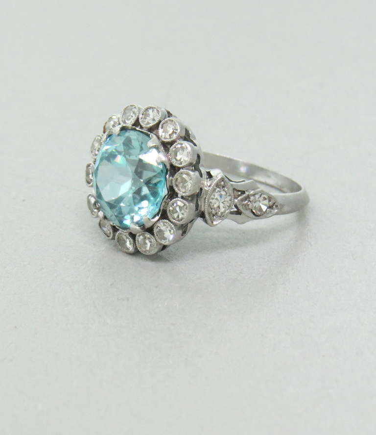 Stunning antique Belle Epoque platinum ring featuring approx. 4.95ct Zircon and diamonds. The ring contains natural blue zircon and approx. 0.72ctw diamonds. The total weight of the ring is 5.3 grams.
Ring size 5.5, top of the ring 14.3mm in