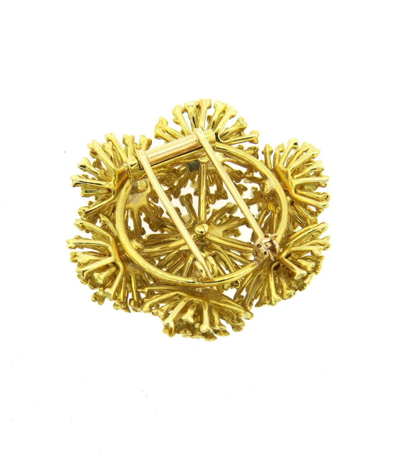 An 18k yellow gold brooch pin crafted by Tiffany & Co.  The brooch measures 40mm x 40mm and weighs 37.2 grams.  Marked Tiffany & Co 18k.