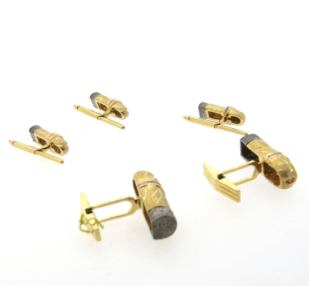 A 14k gold cufflinks and studs set depicting cigars, set with approximately 0.18ctw of H/VS diamonds.  The cufflinks measure 26mm x 9mm and the studs measure 18mm x 7mm. The set weighs 32 grams.  Marked 14k