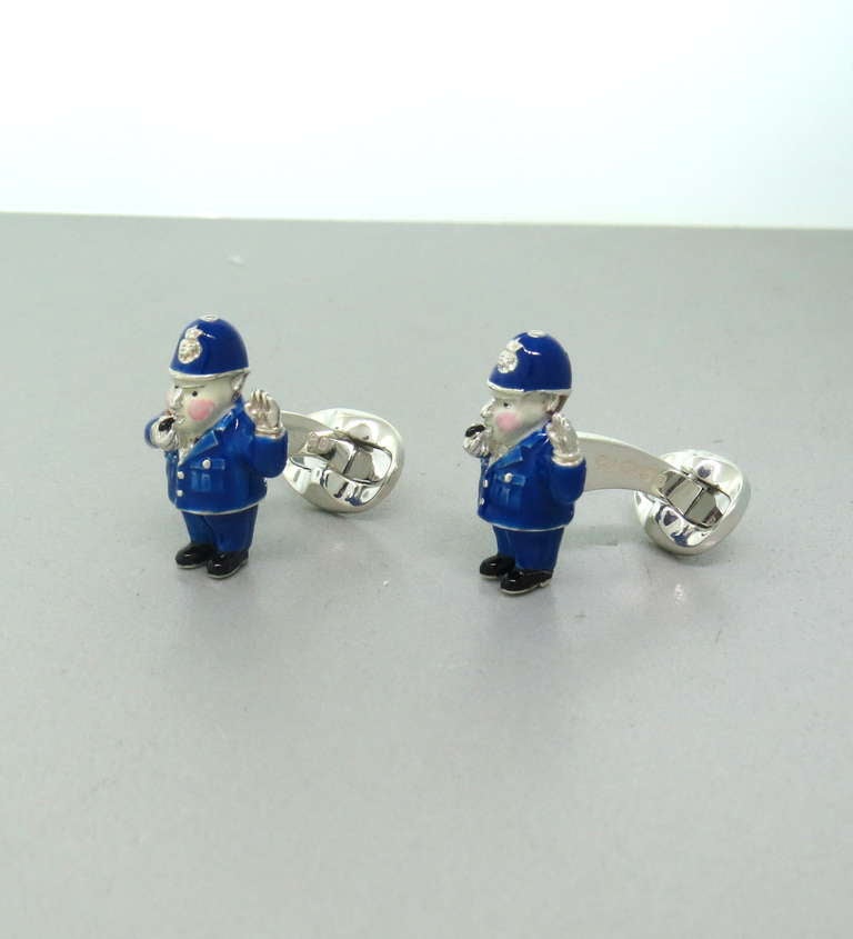 Brand new pair of Deakin & Francis sterling silver and enamel policeman cufflinks  - tops measuring 25mm x 16mm. Marked Deakin & Francis, 925. Weight - 24g. Come with box and papers