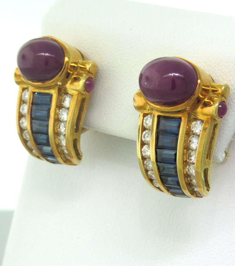 Vintage 1980s 18k gold earrings with approx. 5.5-6ctw ruby cabochons, baguette sapphires - approx. 1.80ctw and 1.20ctw G/VS diamonds. Earrings are 25mm x 18mm. weight - 23g