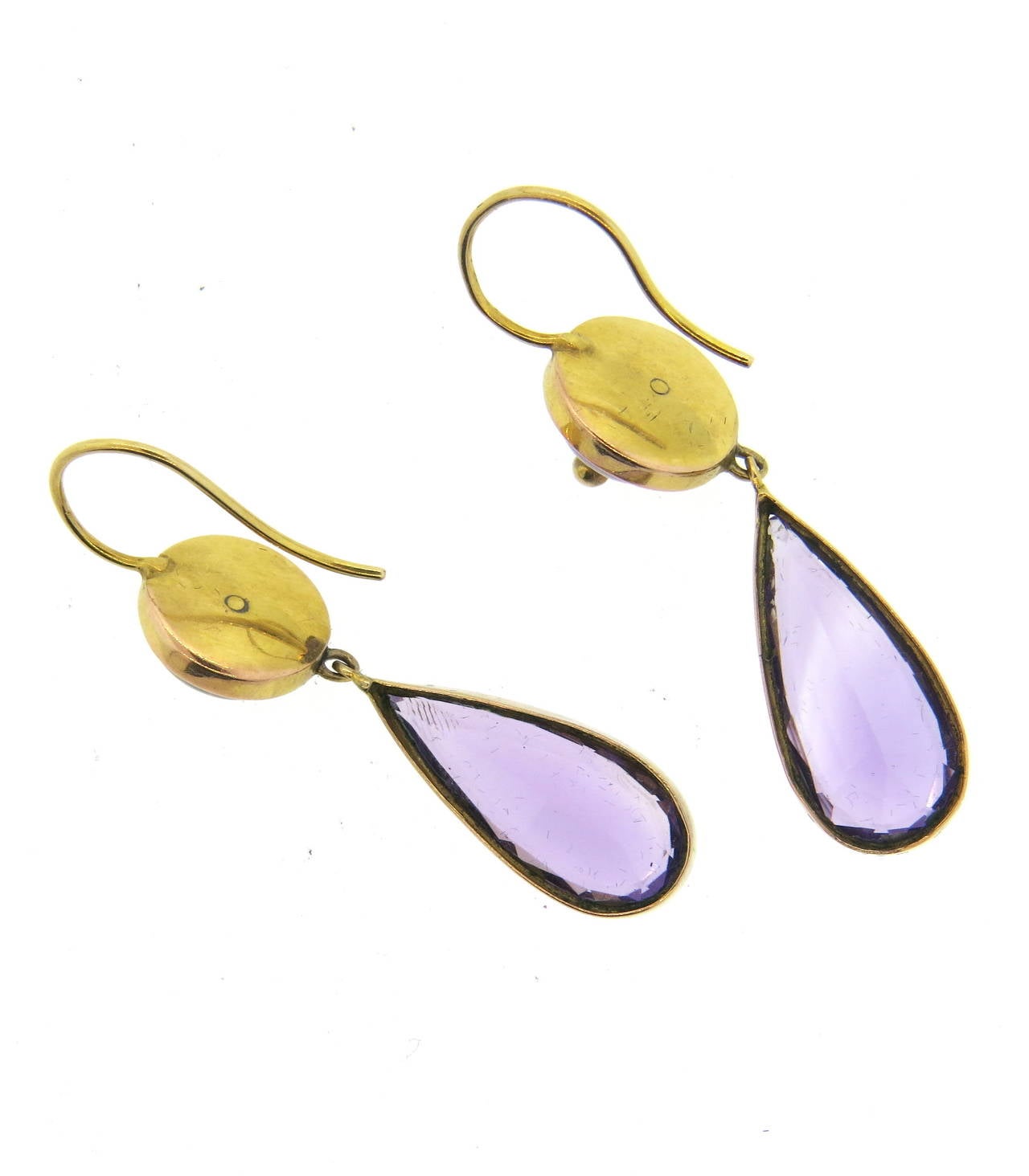 Victorian 14k gold earrings, set with amethyst gemstones. Earrings measure 43mm with wire x 10.5mm wide. Weight - 7.1 grams