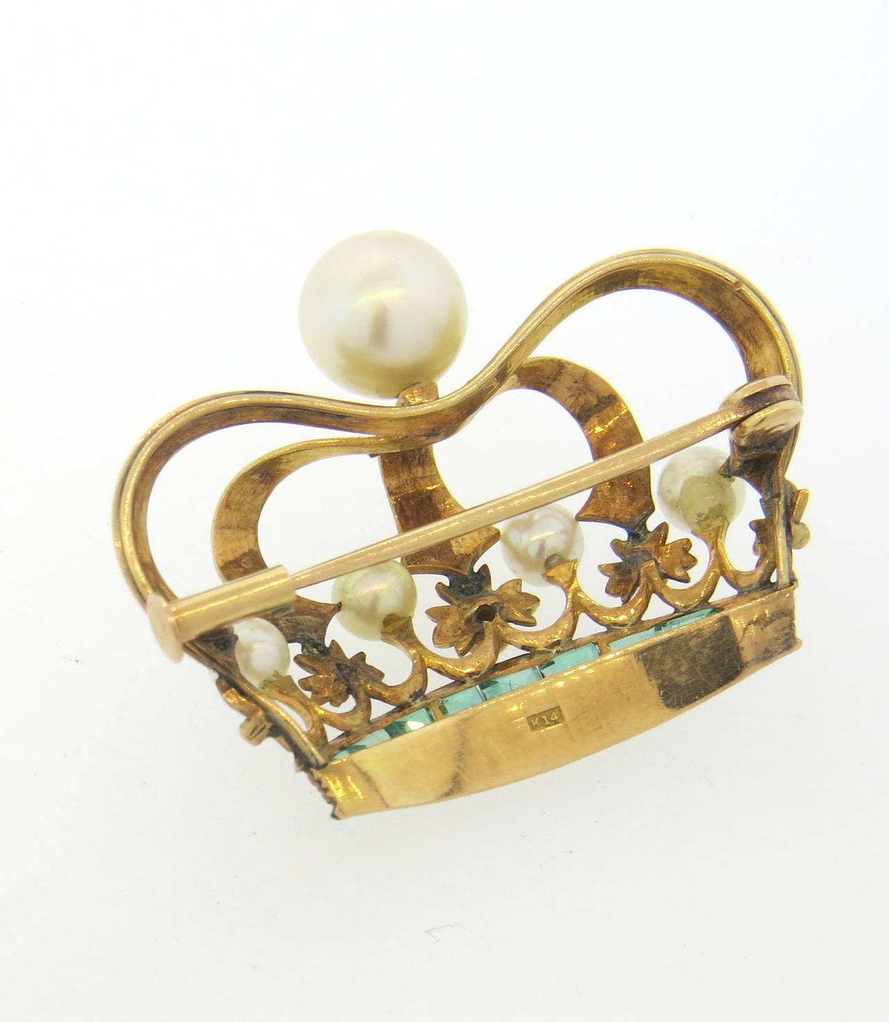 Antique 14k gold crown brooch, set with a diamond, emeralds and five pearls. Brooch measures 32mm x 25mm. Marked k14. Weight - 5 grams