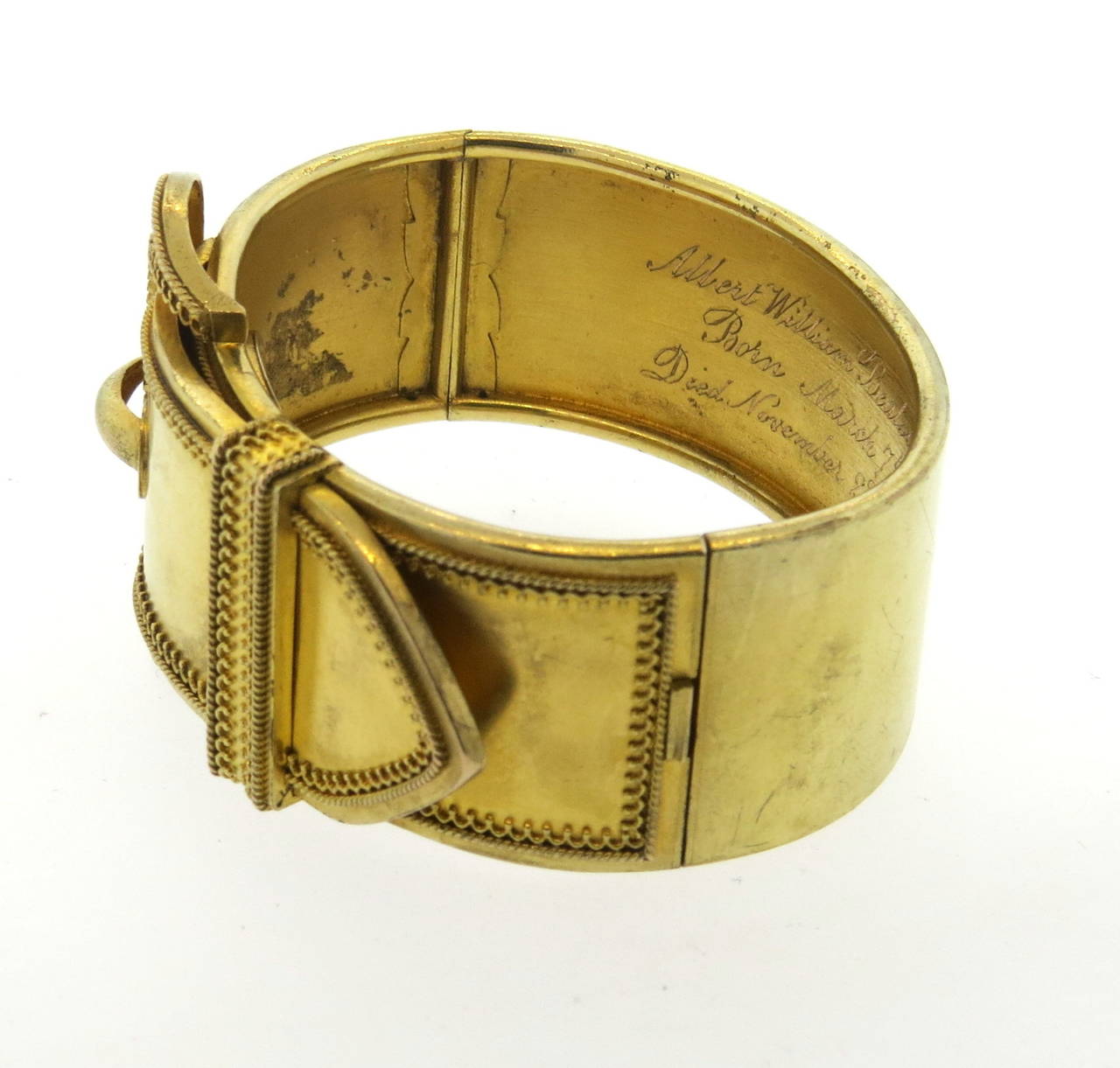 Antique circa 1870s 14k gold bangle, featuring buckle design. Bracelet will fit up to 6 1/2