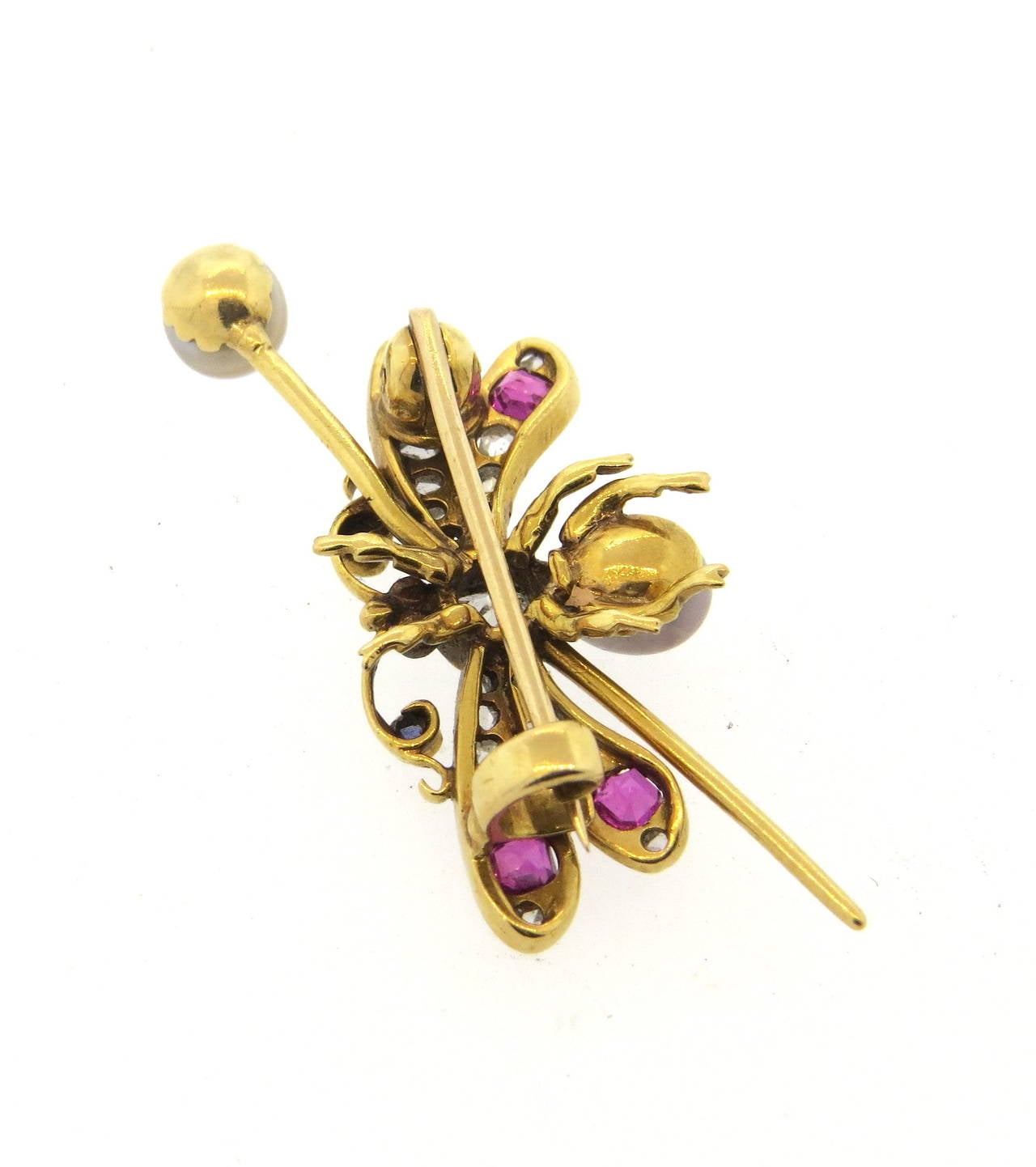 Antique 14k gold brooch, depicting pinned insect, set with one Old Mine cut diamond (approx. 0.40ct) in the center, surrounded with pearls, rose cut diamonds and sapphires. Brooch measures 45mm x 19mm. Weight of the piece - 5.9 grams