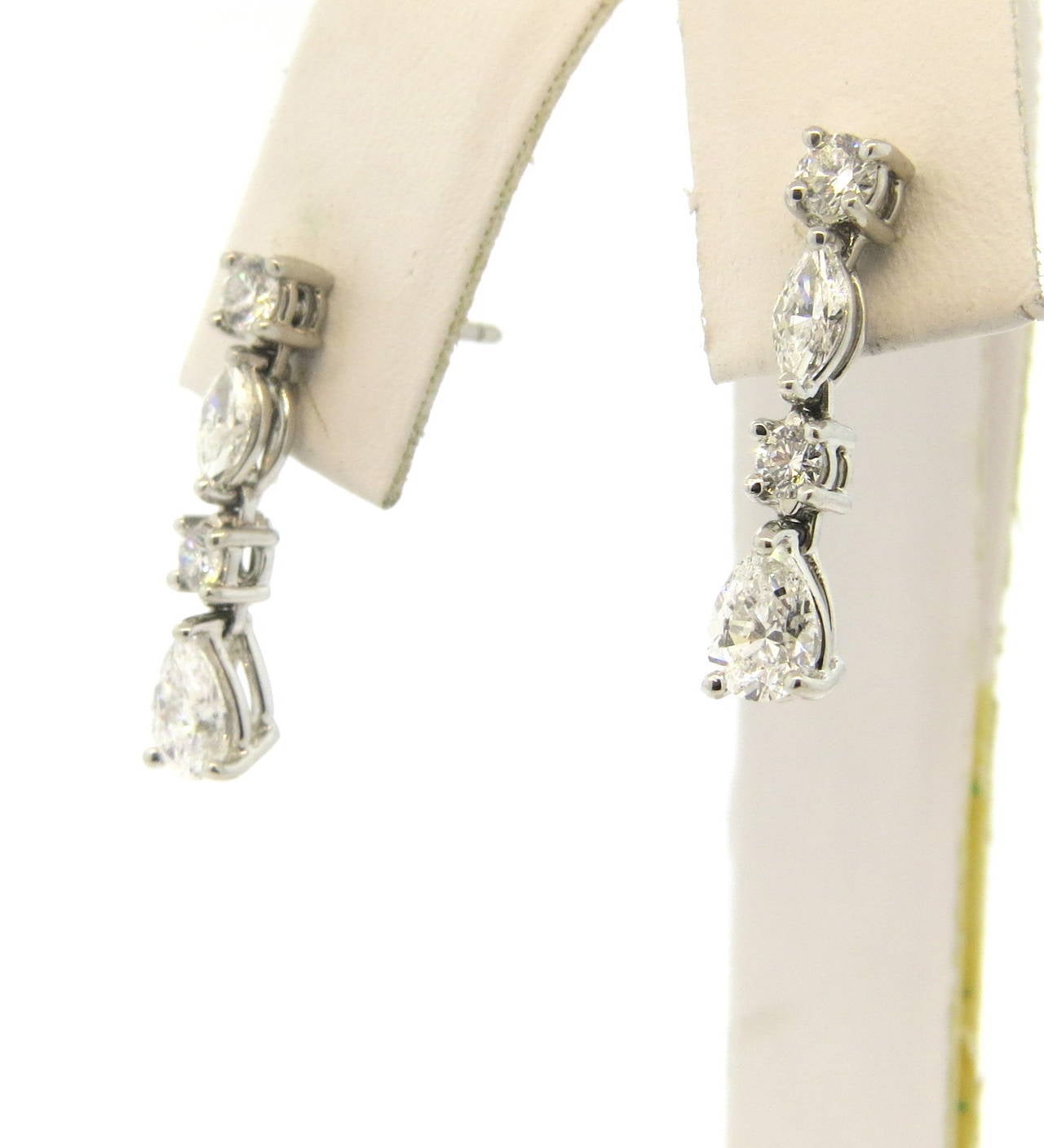 Classic and delicate Tiffany & Co. drop earrings, set in platinum, featuring pear, marquis and round brilliant cut diamonds, with a total approximate weight of  1.50ctw. Earrings are 20mm x 4.5mm wide. Marked Tiffany & Co., pt950. Weight - 4 grams