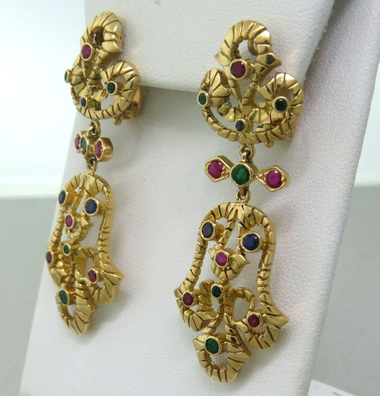 Metal: 18k Yellow Gold
Gemstones: Sapphires, Rubies, Emeralds
Dimensions: 58mm x 22mm
Weight: 24.1 grams