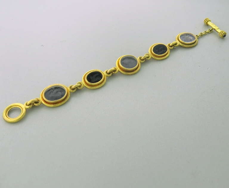 Elizabeth Locke 18k gold bracelet with intaglio onyx and venetian glass animal sections. Bracelet is 7 3/4